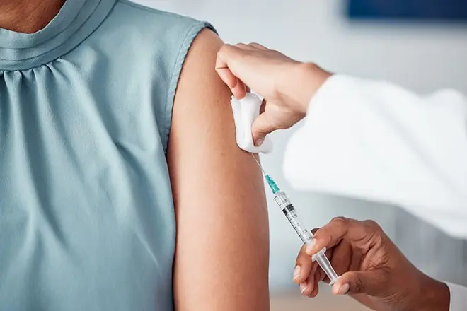 doctor administering an injection