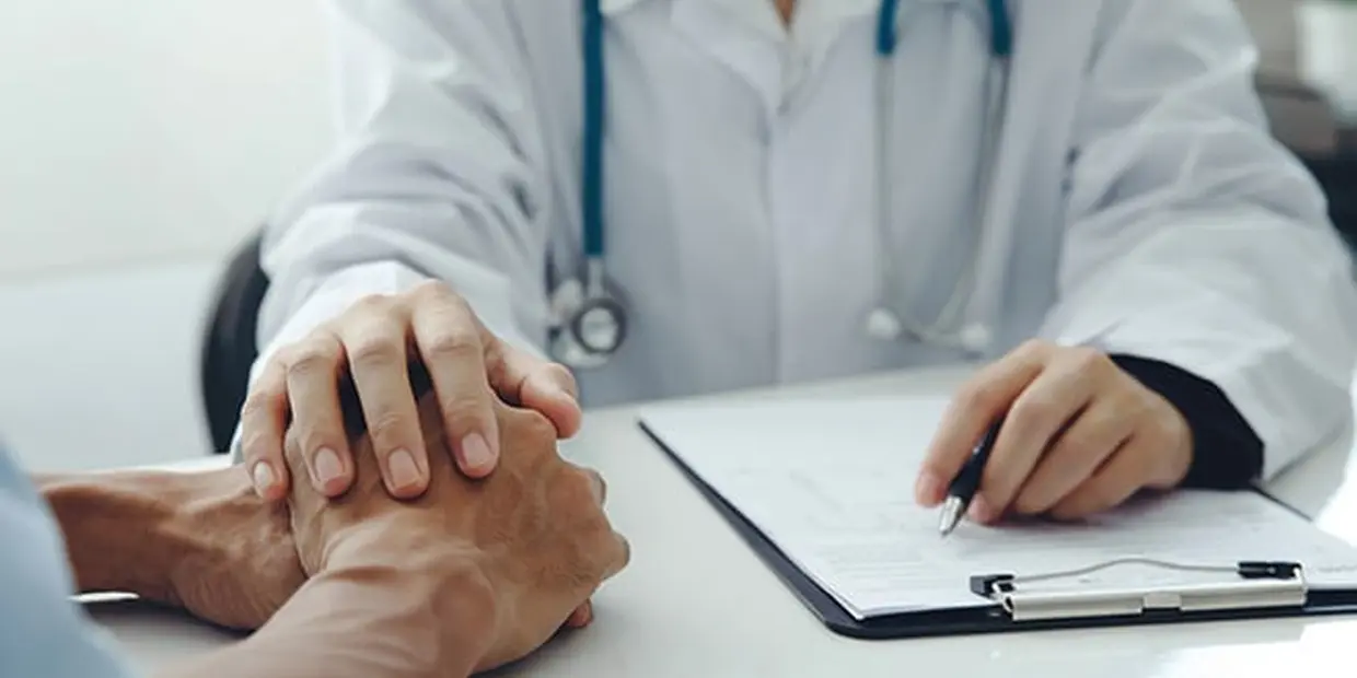 doctor holding a patient's hand as they continue their Suboxone or Vivitrol treatment at Brightside